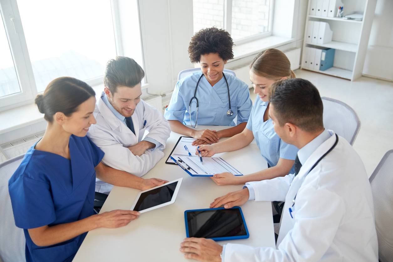 group of happy doctors meeting at hospital office